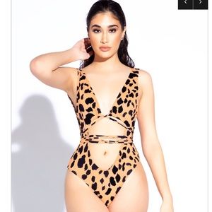 One piece ‘multi tie’ bathing suit.